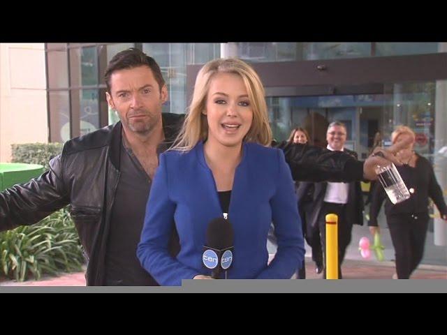 Hugh Jackman photobombs reporter Jessica Turner