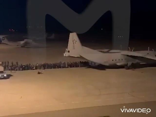 The loading of mobilized Russians onto a plane at the Magadan airport.