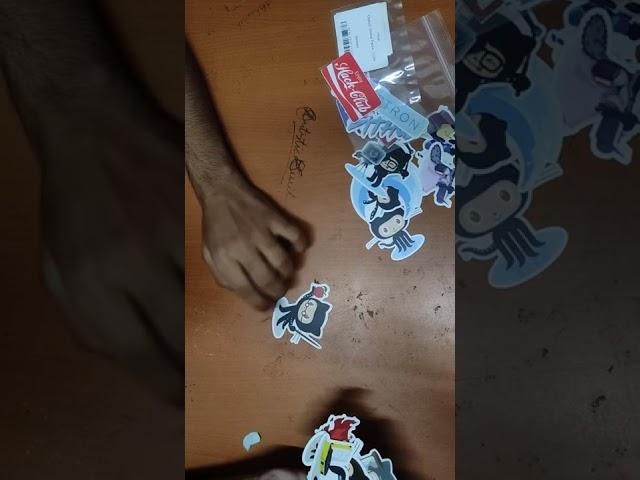 Unboxing GitHub sticker swags on a dirty table | #GitHub