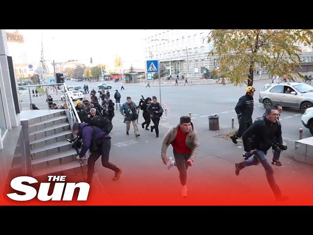 Civilians scramble for shelter as explosions rock Ukraine's capital Kyiv