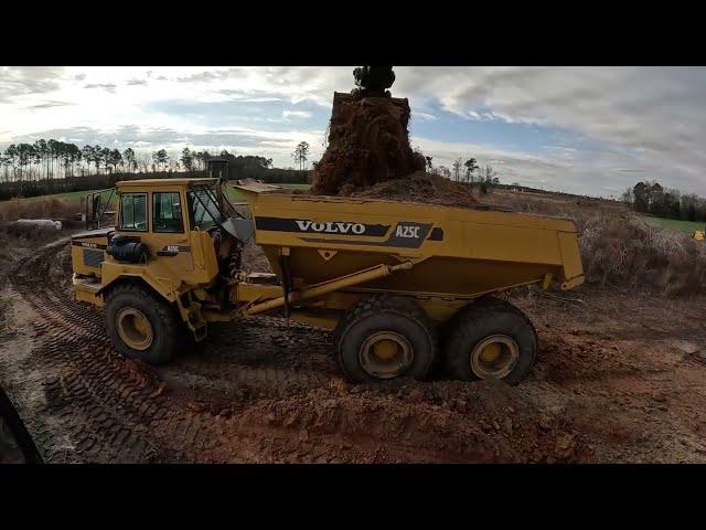 Raising The Road With Clay And Spreading Stone