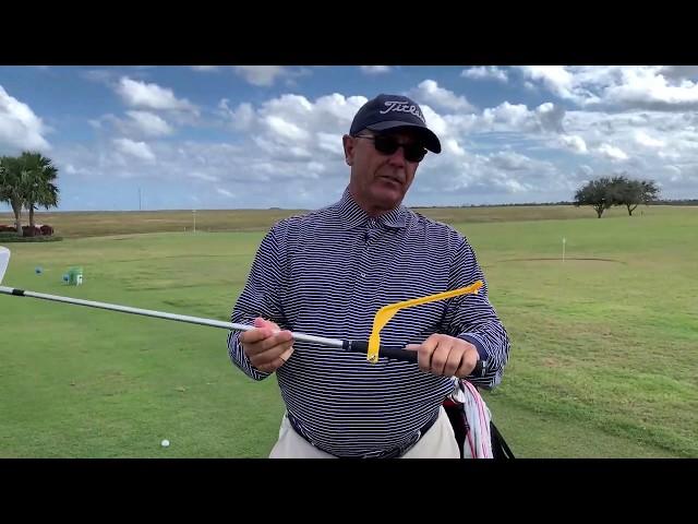 Tom Patri demonstrates the Swingyde golf training aid.