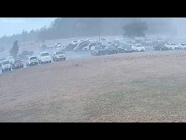 Surveillance video shows tornado tossing cars at Loris High School