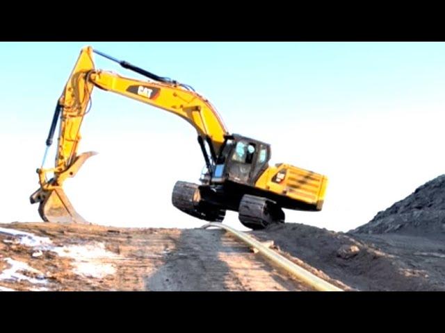 Excavator Hopping a Pipeline