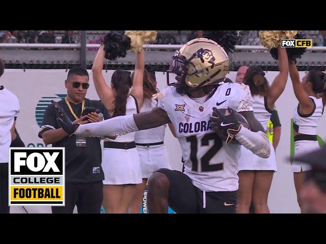 Colorado's Travis Hunter hauls in an UNREAL interception, strikes Heisman pose