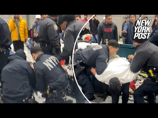 Dramatic confrontation between migrants, cops ends with arrest at Randall’s Island shelter