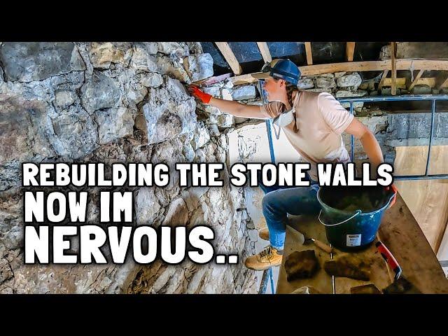 Traditional farmhouse restoration - fixing the stone walls in old stone cottage.