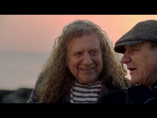 Brian Johnson & Robert Plant share a gorgeous sunset on a beach in Wales