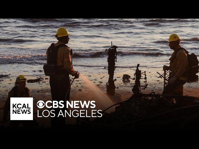 Crews continue to battle wildfires as Los Angeles braces for more winds