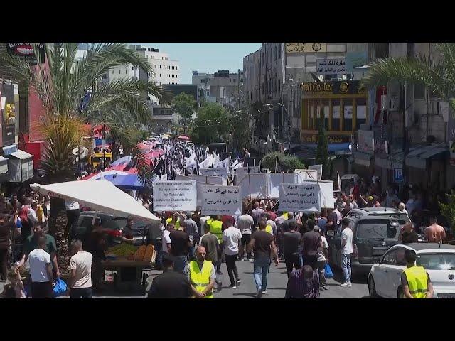 Hundreds of Palestinians march in Ramallah after Friday prayers in support of Gaza