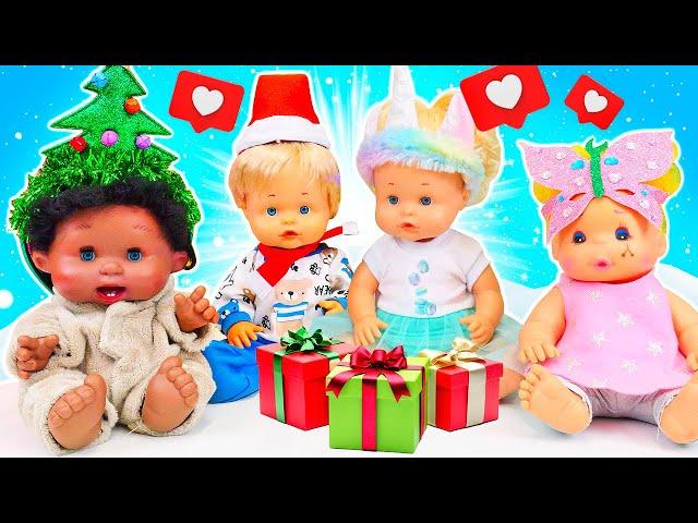 Baby dolls decorate the Christmas tree with beautiful toys and ornaments. Christmas videos for kids.