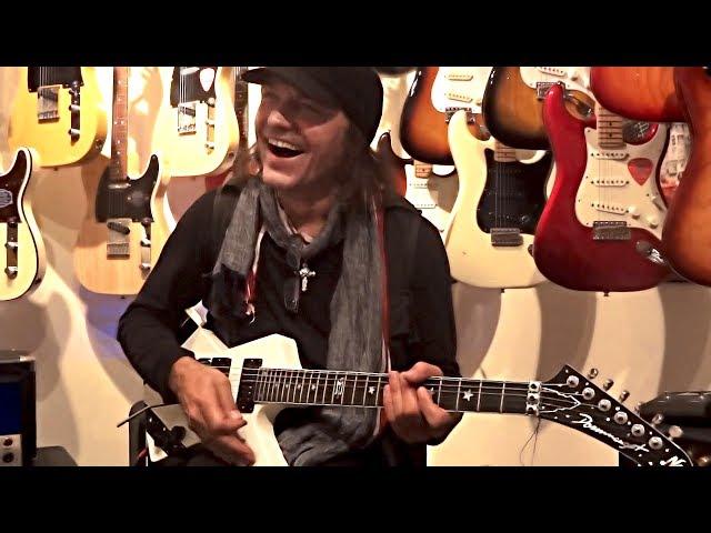 Matthias Jabs Playing In A Guitar Shop