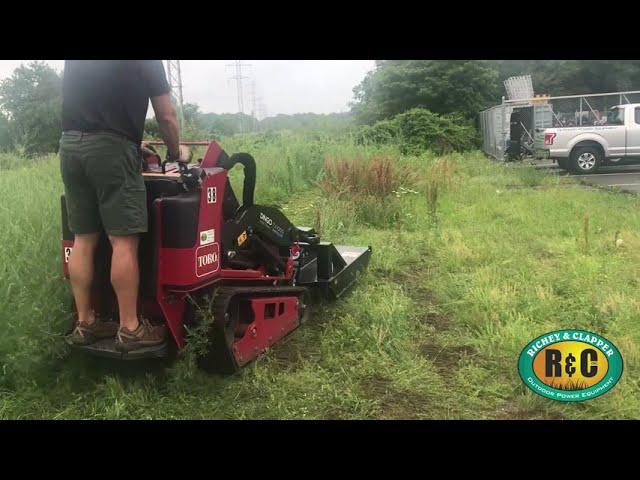 Richey & Clapper Cuts through Heavy Brush with the Brush Wolf 4200 Brush Hog attachment on a Toro