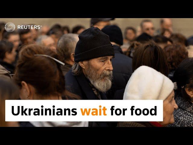 Displaced Ukrainians crowd for aid in Dnipro