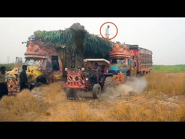 Tractor pulling Truck stuck in sand/Pulling with massey ferguson 385 & mf 375