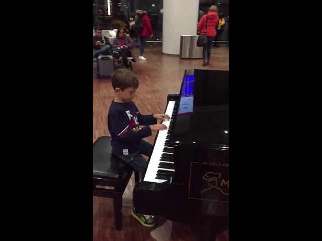 Airport Orio al Serio Bergamo, Mattia  at the piano waiting to leave #yamahapiano #aeroportobergamo