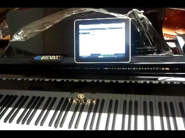 Jim Steagall at the Player Piano Guys installs #QRS system inside Taylor Piano