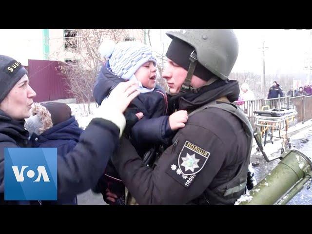 Ukrainian Police Officer Says Goodbye to Distraught Son as Family Flees Irpin