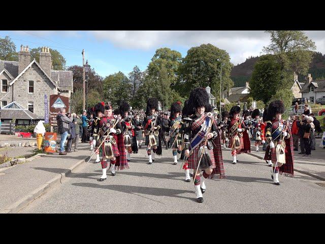 Massed Pipes and Drums march to the 2019 Braemar Gathering in Royal Deeside, Aberdeenshire, Scotland