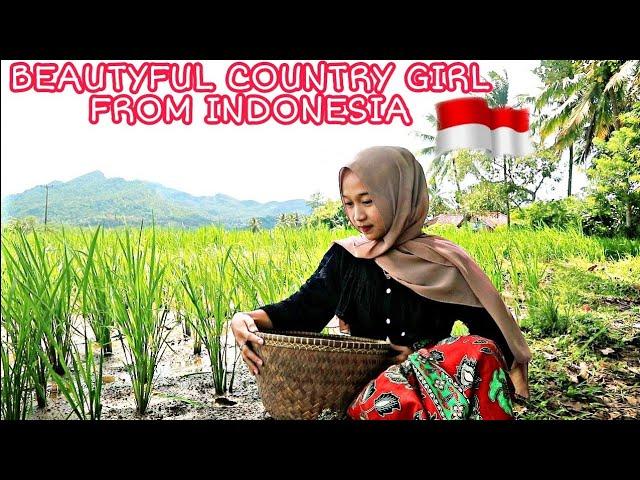 The charm of a beautiful village girl in a remote village is diligent in an Indonesian village