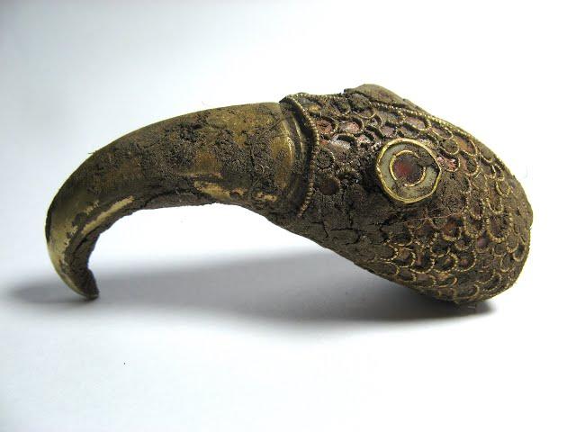 Saxon gold treasure as found gold ring and  gold raven head