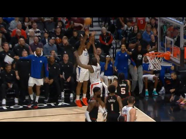 James Harden tries to block Kawhi Leonard's shot attempt 