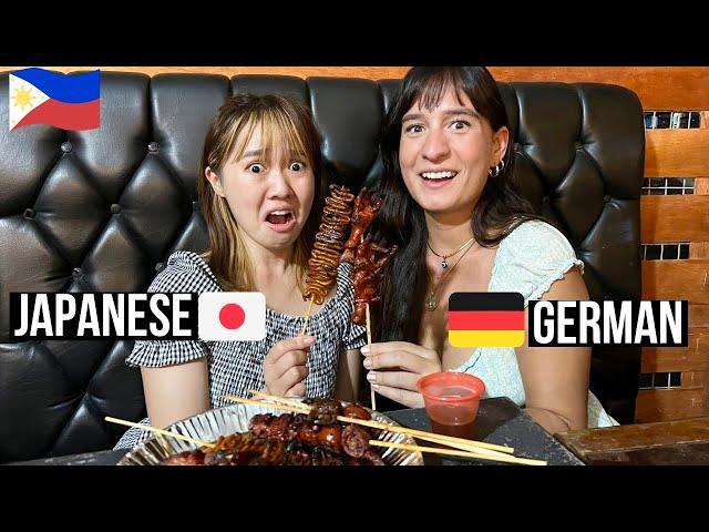 Foreigners trying FILIPINO Street Food at Nightmarket  Isaw, Pig Ear, Chicken Feet…