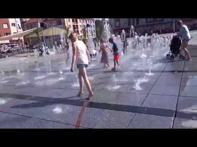 Koszalin (Poland): kids playing at the fountain, making fun