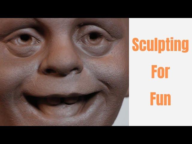 Sculpting silly face in clay . Sculpting for fun. Process of sculpting and playing with clay.