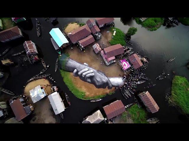 Giant hands painted at former African slave hub