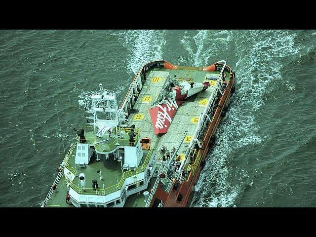 Indonesia search teams home in on AirAsia fuselage