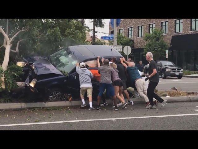 20 People Help Flip SUV to Free Those Trapped Inside