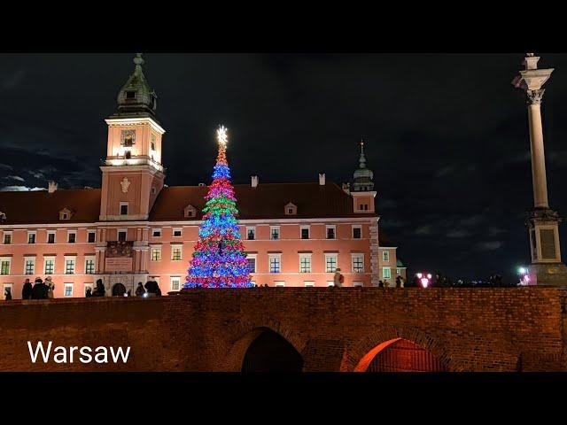 Walking in the evening Warsaw, Poland. Christmas atmosphere. Traveling around Europe in December