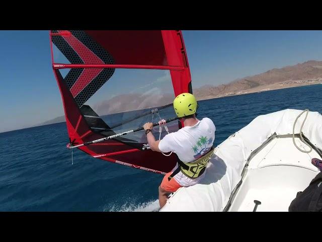 Windsurfing start from a rescue boat