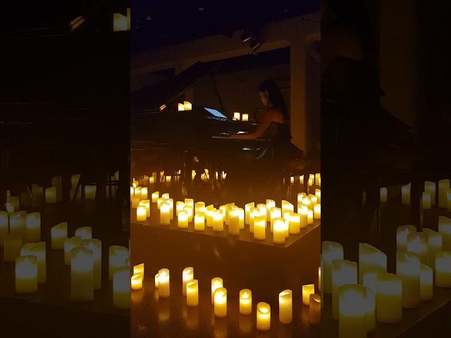 Van Anh: How far ill go-Moana: Grand piano surrounded by candles.