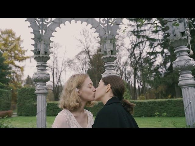 lesbian couple kissing in the park