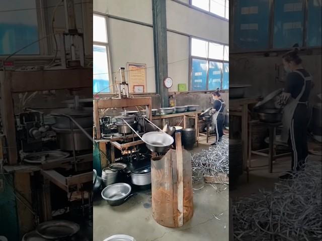 A glimpse into a metal bowl manufacturing process.