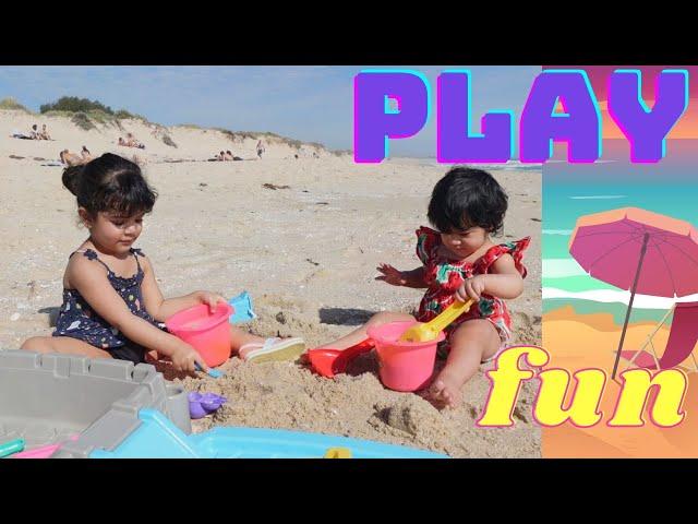 Nooni and Looli playing at the beach