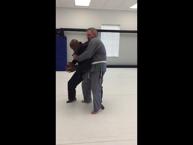 Brazilian Jiu-Jitsu self-defense against bear hug from behind