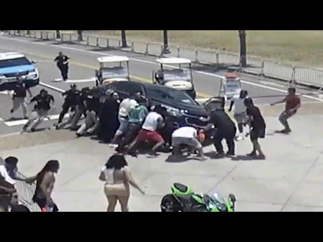 Good Samaritans Race to Lift Car off Motorcyclist