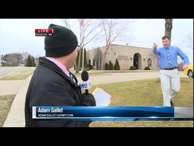 Watch a Bank Robber Interrupt This News Reporter During Live Broadcast