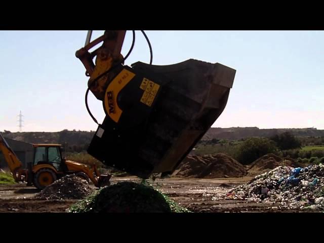 MB crusher bucket crushing bottles of glasses - www.mbcrusher.com