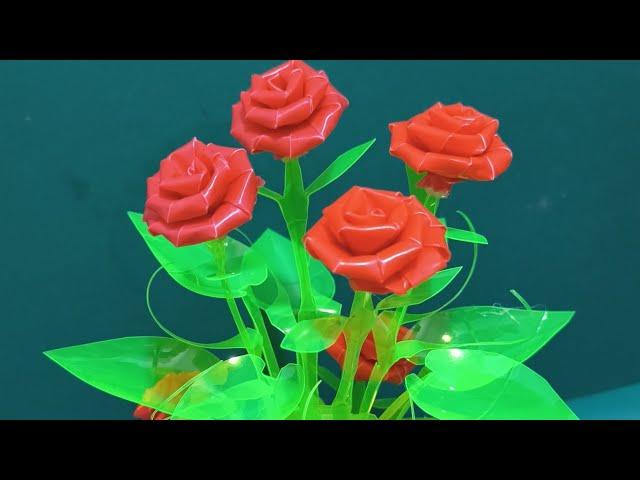 rose flower with leaves made out of soda bottle & drinking straw