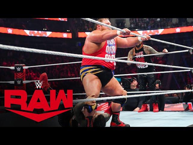 Otis struts across the ring with Jey Uso hanging on to his feet on Raw