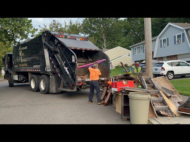 Garbage Truck Packing A Big Bulk Pile