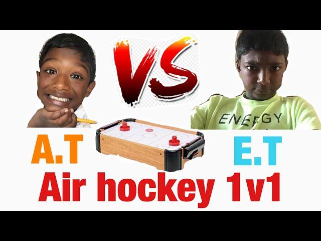 Playing Mini Air Hockey by ET & AT