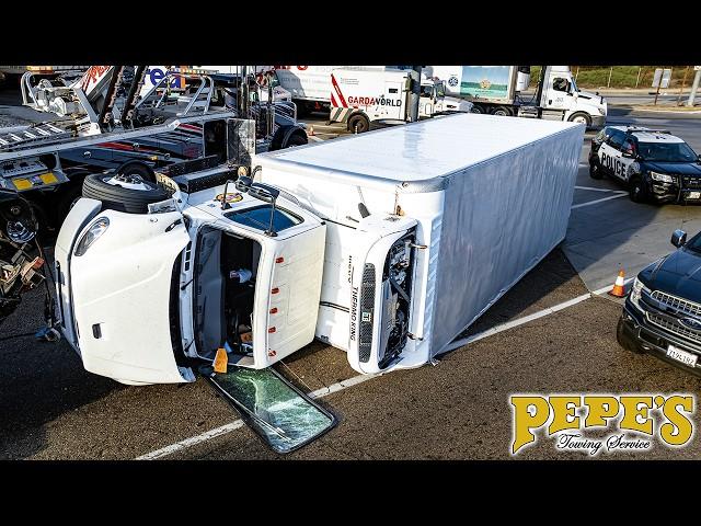 Box Truck Rolls Over Through Busy Intersection!