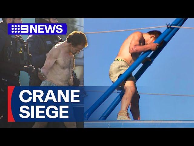 Man arrested after dramatic standoff with police on top of crane | 9 News Australia