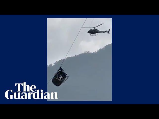 Children trapped in chairlift hanging 900ft above ravine in Pakistan