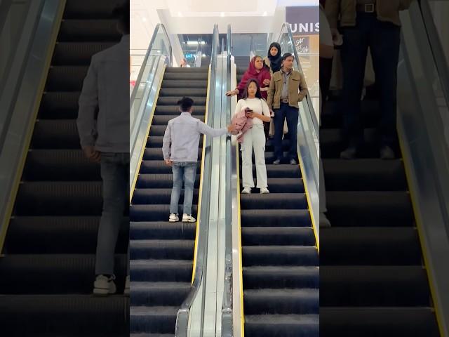 Jacket snatching ￼prank on Escalator #shorts #love #newsong #shortsfeed #shortsvideo #ytshorts